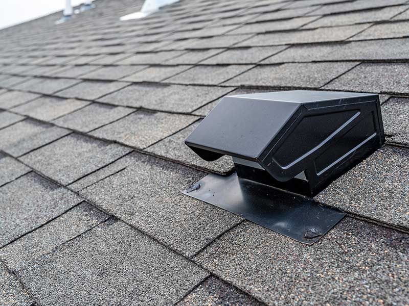 Static vent installed on a shingle roof for passive attic ventilation